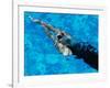 Young Woman Swimming Underwater in a Swimming Pool-null-Framed Photographic Print