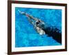 Young Woman Swimming Underwater in a Swimming Pool-null-Framed Photographic Print