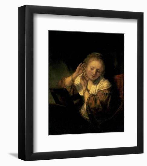 Young Woman Trying Earrings, 1654-Rembrandt van Rijn-Framed Art Print