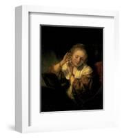 Young Woman Trying Earrings, 1654-Rembrandt van Rijn-Framed Art Print