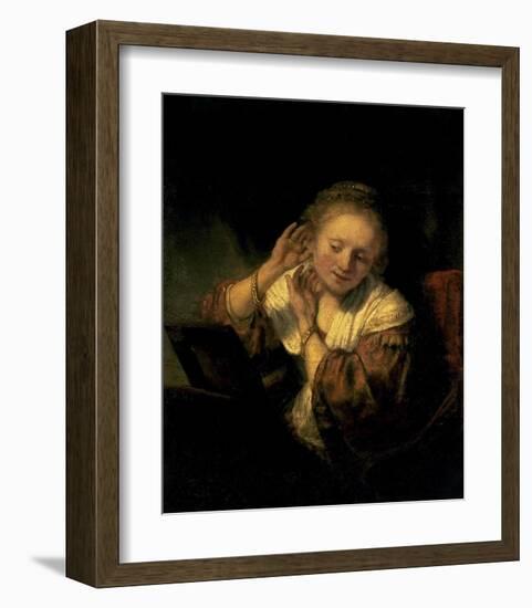 Young Woman Trying Earrings, 1654-Rembrandt van Rijn-Framed Art Print