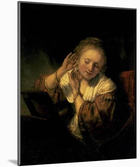 Young Woman Trying Earrings, 1654-Rembrandt van Rijn-Mounted Art Print