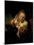 Young Woman Trying Earrings, 1654-Rembrandt van Rijn-Mounted Art Print