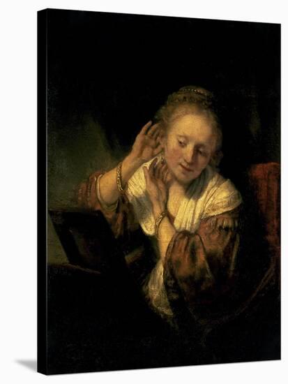 Young Woman Trying Earrings, 1654-Rembrandt van Rijn-Stretched Canvas