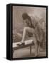 Young Woman Wearing a Fur Coat Cloche Hat and T-Bar Shoes Lifts Her Leg Up-null-Framed Stretched Canvas