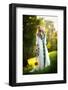 Young Woman Wearing a Long White Dress Holding a Sunflower Outdoor Shot. Portrait of Beautiful Girl-iancucristi-Framed Photographic Print