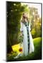 Young Woman Wearing a Long White Dress Holding a Sunflower Outdoor Shot. Portrait of Beautiful Girl-iancucristi-Mounted Photographic Print