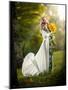 Young Woman Wearing a Long White Dress Holding Sunflowers Outdoor Shot. Portrait of Beautiful Blond-iancucristi-Mounted Photographic Print