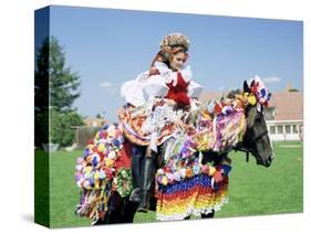 Young Woman Wearing Folk Dress on Horseback, Ride of the Kings Festival, Village of Vlcnov, Vlcnov-Richard Nebesky-Stretched Canvas