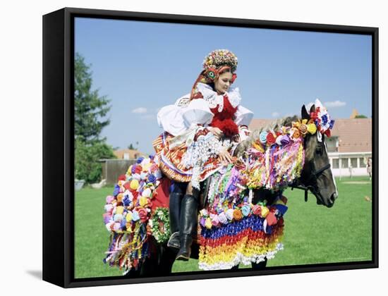 Young Woman Wearing Folk Dress on Horseback, Ride of the Kings Festival, Village of Vlcnov, Vlcnov-Richard Nebesky-Framed Stretched Canvas