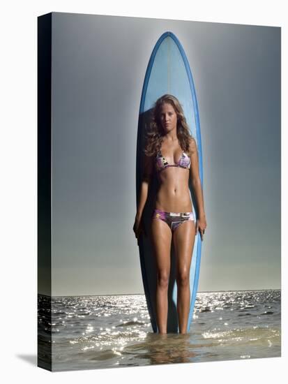 Young Woman with a Surfboard-Ben Welsh-Stretched Canvas