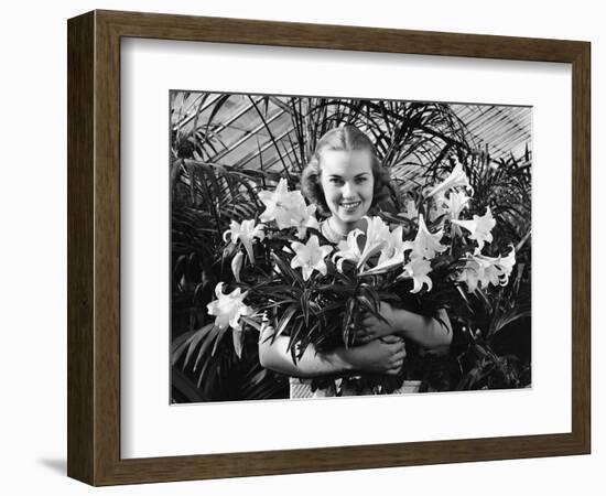 Young Woman with Arms Full of Easter Lillies-Philip Gendreau-Framed Photographic Print