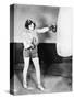 Young Woman with Boxing Gloves Trains with a Punching Bag-null-Stretched Canvas