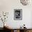 Young Woman with Long Hair Indoors with Paper-Carolina Hernandez-Framed Photographic Print displayed on a wall