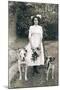 Young Woman with Two Dogs in a Garden-null-Mounted Photographic Print