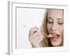 Young Womand Eating Cornflakes from a Spoon-null-Framed Photographic Print