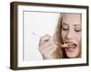 Young Womand Eating Cornflakes from a Spoon-null-Framed Photographic Print