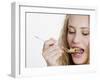 Young Womand Eating Cornflakes from a Spoon-null-Framed Photographic Print