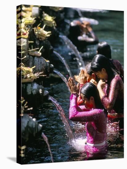 Young Women at Tirta Empul Temple, Ubud Region, Island of Bali, Indonesia, Southeast Asia-Bruno Morandi-Stretched Canvas