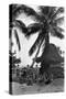 Young Women in Polynesian-Flapper Costumes Lounge under a Coconut Palm-null-Stretched Canvas