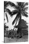 Young Women in Polynesian-Flapper Costumes Lounge under a Coconut Palm-null-Stretched Canvas