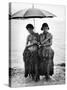 Young Yap Island ladies sporting traditional Grass Skirts, Sharing umbrella in the Caroline Islands-Eliot Elisofon-Stretched Canvas