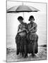 Young Yap Island ladies sporting traditional Grass Skirts, Sharing umbrella in the Caroline Islands-Eliot Elisofon-Mounted Photographic Print