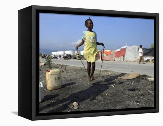 Youth Jumps Rope in a Camp for People Displaced by the Earthquake in Port-Au-Prince-null-Framed Stretched Canvas