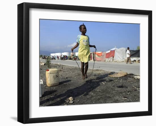 Youth Jumps Rope in a Camp for People Displaced by the Earthquake in Port-Au-Prince-null-Framed Photographic Print