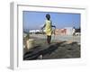 Youth Jumps Rope in a Camp for People Displaced by the Earthquake in Port-Au-Prince-null-Framed Photographic Print