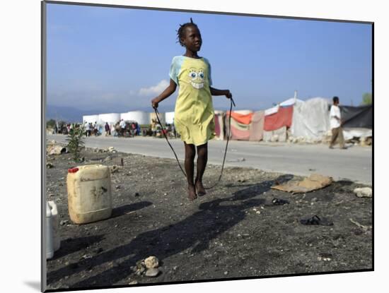 Youth Jumps Rope in a Camp for People Displaced by the Earthquake in Port-Au-Prince-null-Mounted Photographic Print