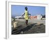 Youth Jumps Rope in a Camp for People Displaced by the Earthquake in Port-Au-Prince-null-Framed Photographic Print