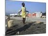 Youth Jumps Rope in a Camp for People Displaced by the Earthquake in Port-Au-Prince-null-Mounted Photographic Print