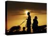 Youth Rides a Donkey Cart Loaded with Other Children, as the Sun Sets on the Outskirts of Islamabad-null-Stretched Canvas