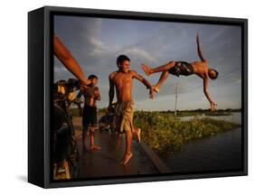 Youths Play in a Lagoon Near the Eastern Beni State Capital of Trinidad, Bolivia-null-Framed Stretched Canvas