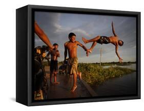 Youths Play in a Lagoon Near the Eastern Beni State Capital of Trinidad, Bolivia-null-Framed Stretched Canvas