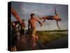 Youths Play in a Lagoon Near the Eastern Beni State Capital of Trinidad, Bolivia-null-Stretched Canvas