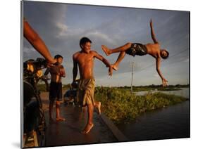 Youths Play in a Lagoon Near the Eastern Beni State Capital of Trinidad, Bolivia-null-Mounted Photographic Print
