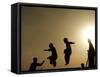 Youths Play on a Trampoline at Sunset in the Neighborhood of Islamabad, Pakistan-null-Framed Stretched Canvas