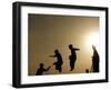 Youths Play on a Trampoline at Sunset in the Neighborhood of Islamabad, Pakistan-null-Framed Photographic Print