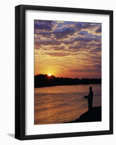 Zambezi National Park, Sausage Tree Camp, Fly-Fishing for Tiger Fish at Sunset on River, Zambia-John Warburton-lee-Framed Photographic Print