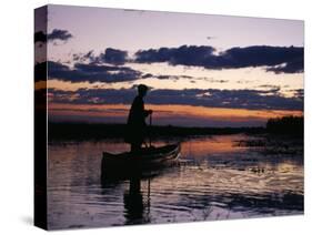 Zambia Game Scout Poling Mokorro Along Lukulu River at Sunset-John Warburton-lee-Stretched Canvas