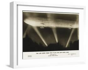 Zeppelin Illuminated by Searchlights-null-Framed Photographic Print