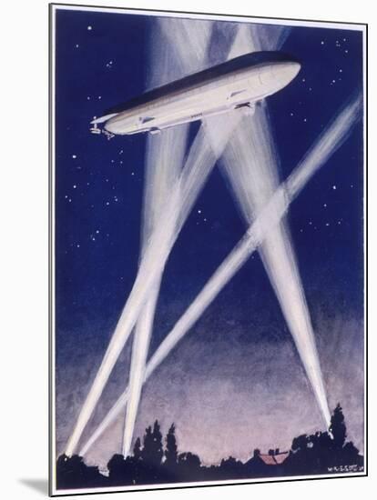 Zeppelin Raider is Caught in the Searchlights Over the Countryside-W.r. Stott-Mounted Photographic Print