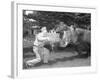 Zookeeper Giving Hippo Bundle of Hay-null-Framed Photographic Print