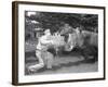 Zookeeper Giving Hippo Bundle of Hay-null-Framed Photographic Print