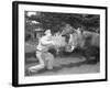 Zookeeper Giving Hippo Bundle of Hay-null-Framed Photographic Print