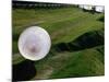 Zorbs People Moving Inside Balls on Lawn, Rotorua, New Zealand-John Banagan-Mounted Photographic Print