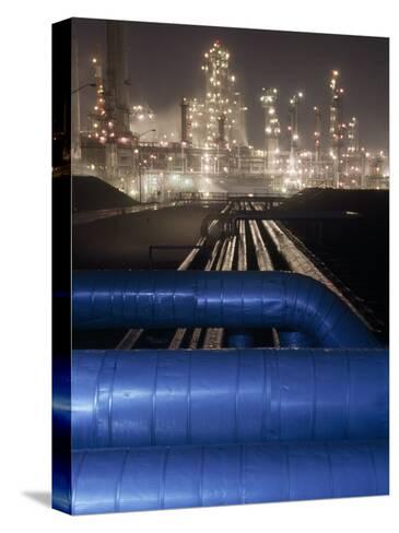 michael-melford-night-view-of-the-lights-of-an-oil-refinery_a-G-6118504-4990703.jpg