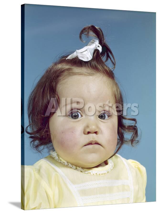 1960s Brunette Baby Girl Ribbon Topknot Yellow Shirt With Chubby Cheeks Round Face